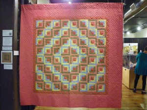 Log Cabin Barn Raising, 73" x 85", c. 1880 Maker Unknown Pennsylvania This Quilt is believed to be Mennonite. The backing fabric is blue and white homespun cotton.  PQ, 2009.012.046 Sharee and Murray Newman Collection
